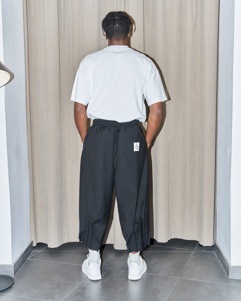 NCB - Deconstructed Knife Pleat Raw Hem Pants